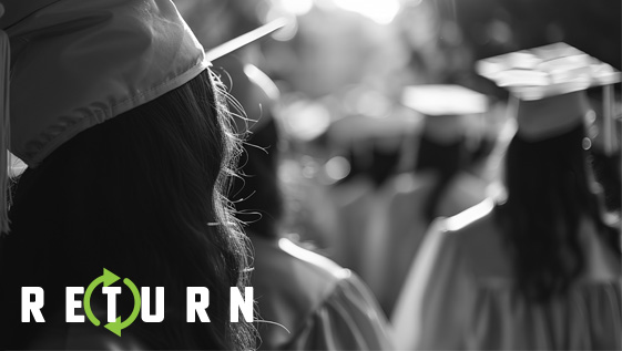The back of graduates walking.