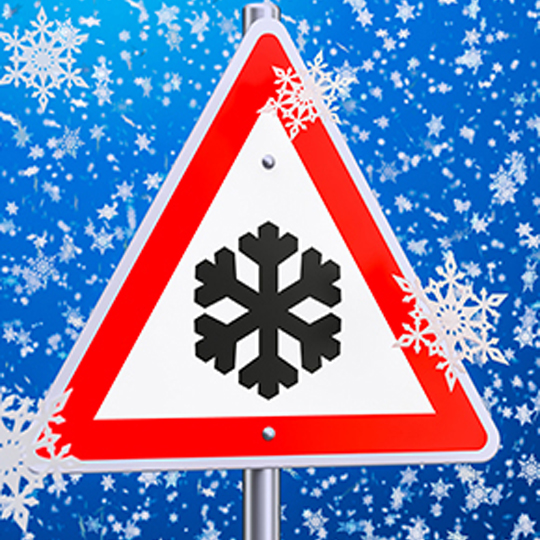 Graphic image of snow falling with a triangle sign and snow flake inside.