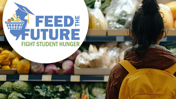Student standing in front of produce with a backpack on.