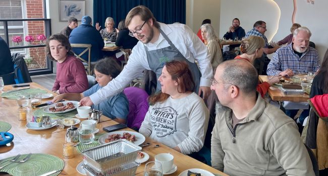 Student serving guests at SCCC's Arbor Restaurant