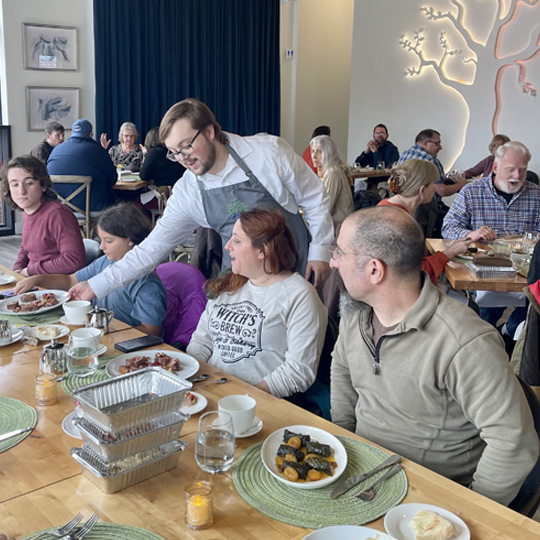 People being served at a Restaurant.