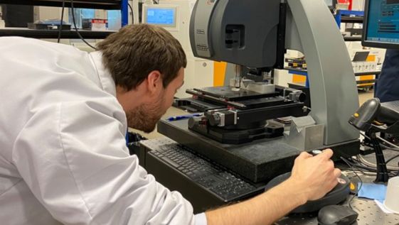 Optics student at SCCC utilizes precision tools.